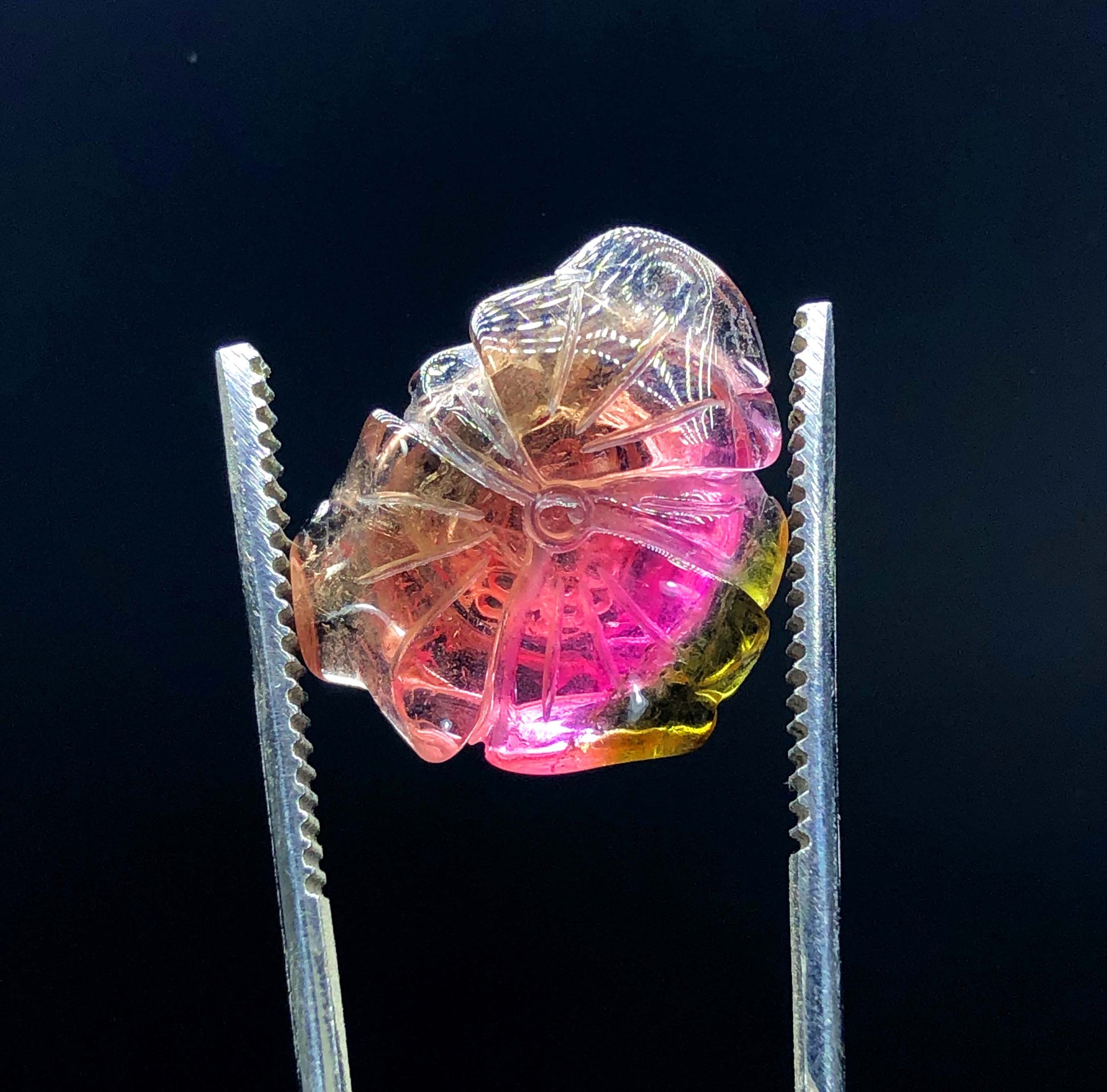 natural multicolor tourmaline stone
jewelry grade tourmaline carving
polished gemstone carving close up