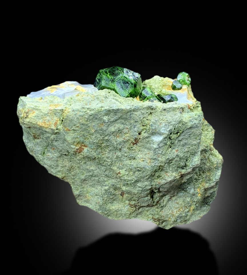 cabinet size demantoid garnet specimen
green garnet crystals with white calcite contrast
untreated demantoid garnet mineral specimen
self standing garnet crystal display piece