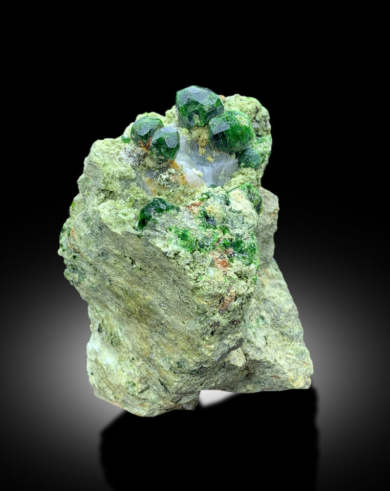 vibrant green garnet specimen from koh e belgheys
demantoid garnet crystal cluster close up